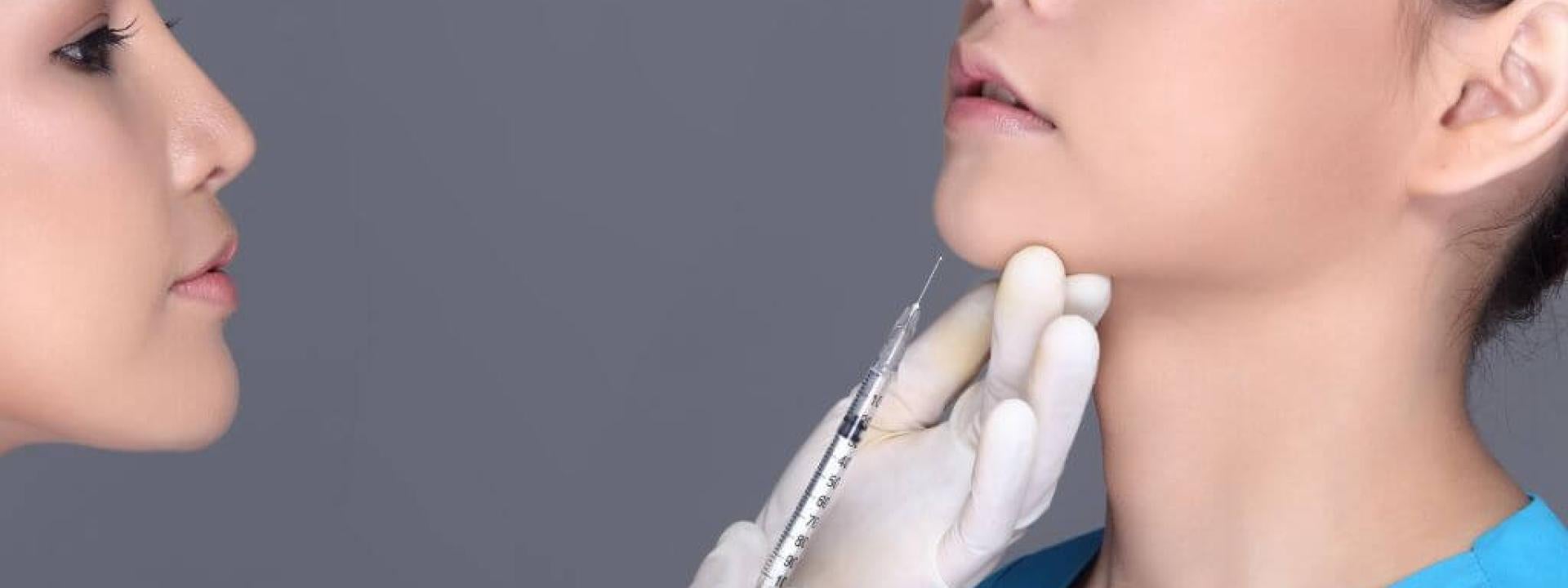 Female dentist injecting woman with botox for dental, oral, and facial conditions